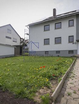 Charmante 4-Zimmerwohnung im ersten Obergeschoss mit Balkon und Gartenanteil - Dittelbrunn