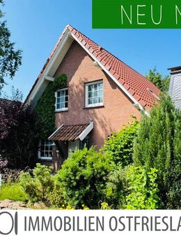 Mit Blick auf die Pferdeweide: Gepflegtes Einfamilienhaus mit Garage und sichtgeschütztem Garten - Krummhörn